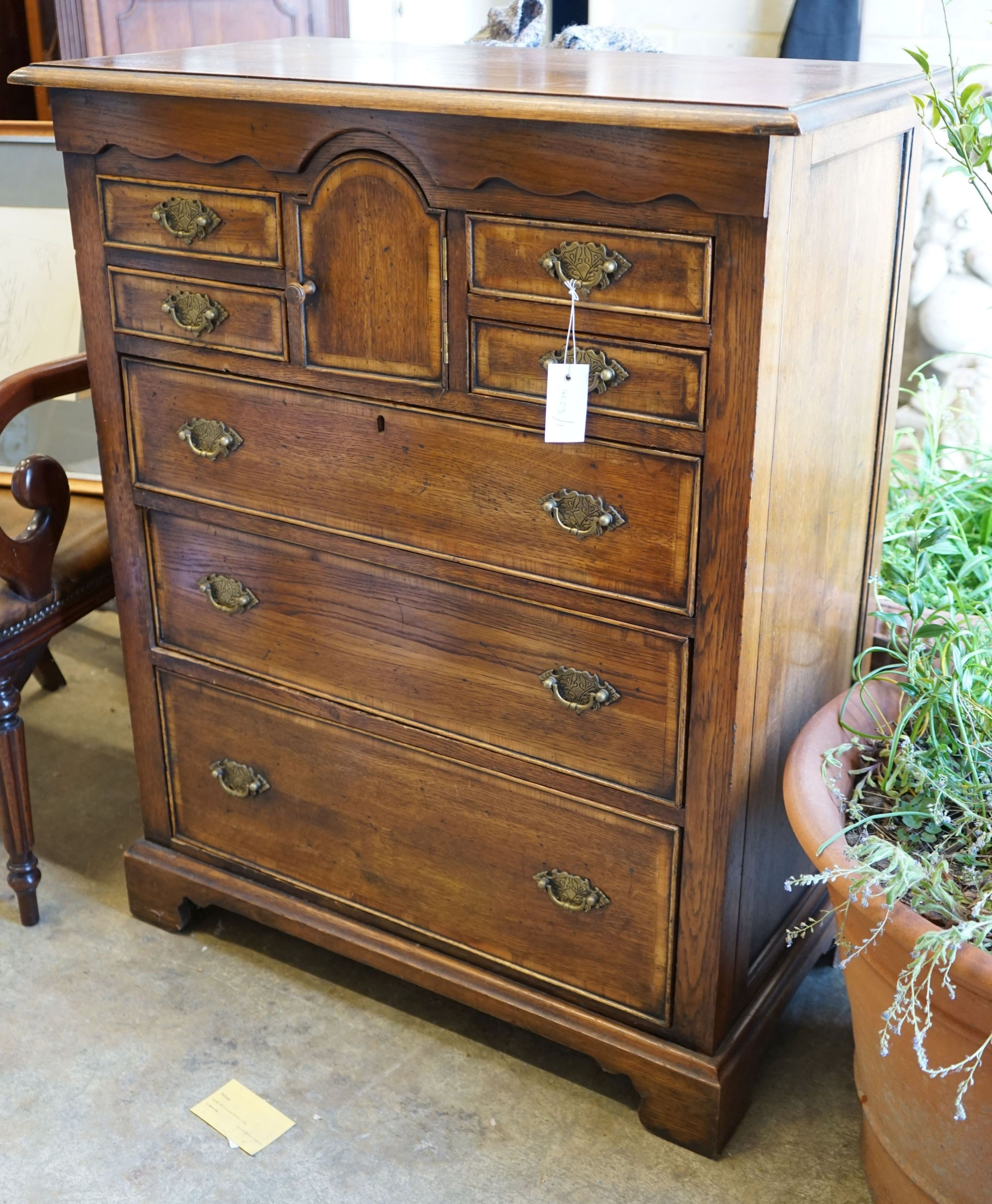 An 18th century style oak chest, width 83cm depth 46cm height 104cm